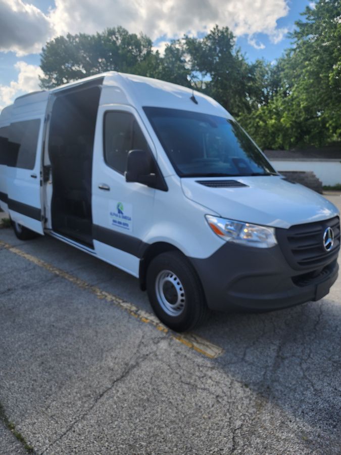 Alpha and Omega Transportation Sprinter van front 3/4 view with sliding door open